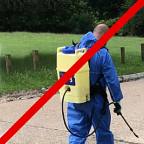 [Workman spraying pesticide]